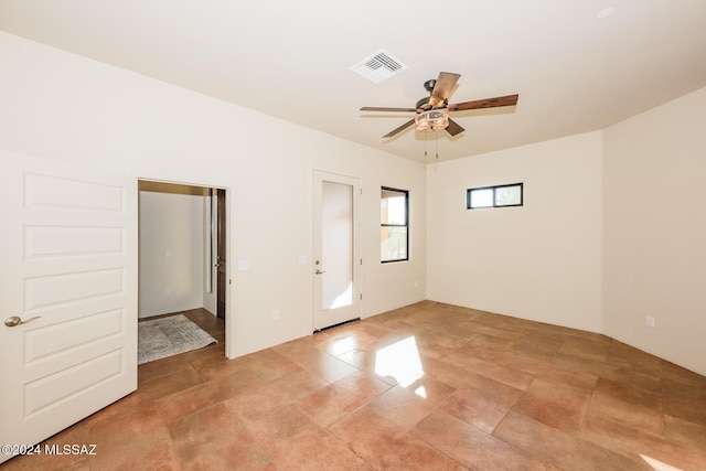 spare room with ceiling fan