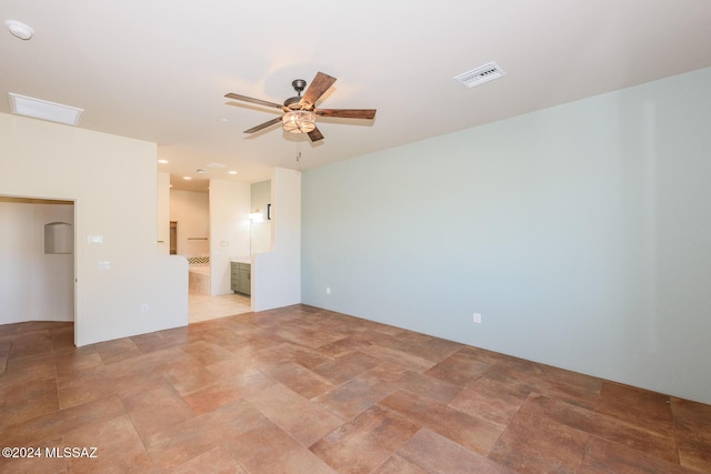 unfurnished room with ceiling fan