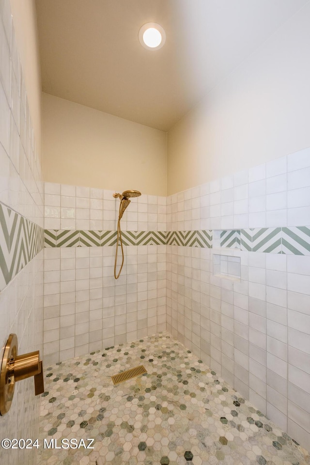 bathroom with tiled shower