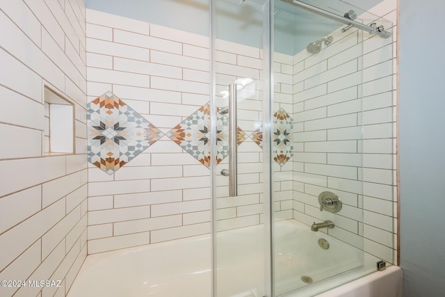 bathroom featuring shower / bath combination with glass door