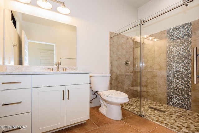 bathroom with vanity, an enclosed shower, tile patterned floors, and toilet