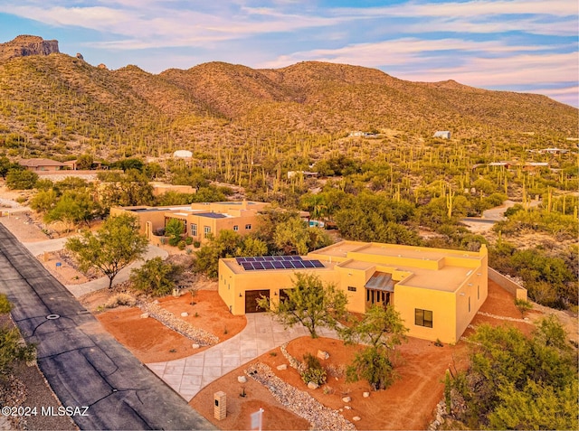 aerial view at dusk with a mountain view