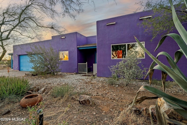 view of front of property featuring a garage