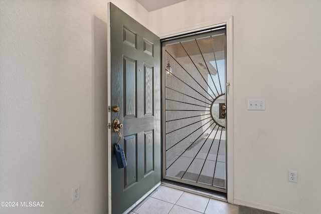 doorway featuring light tile patterned floors