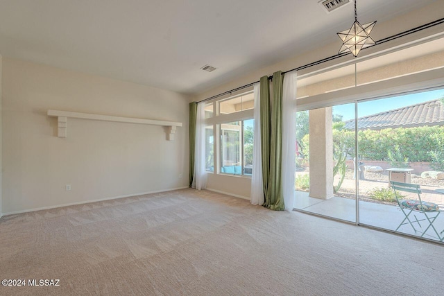 empty room with light colored carpet