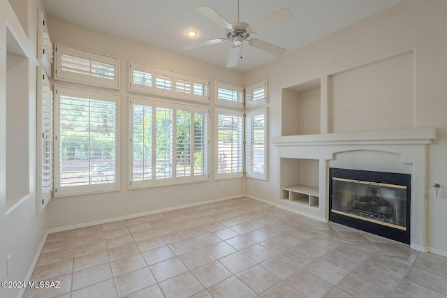 unfurnished living room featuring ceiling fan, built in features, and light tile patterned flooring