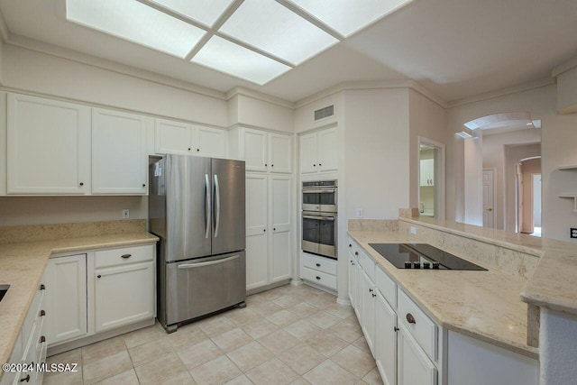 kitchen featuring light stone counters, white cabinetry, crown molding, and appliances with stainless steel finishes