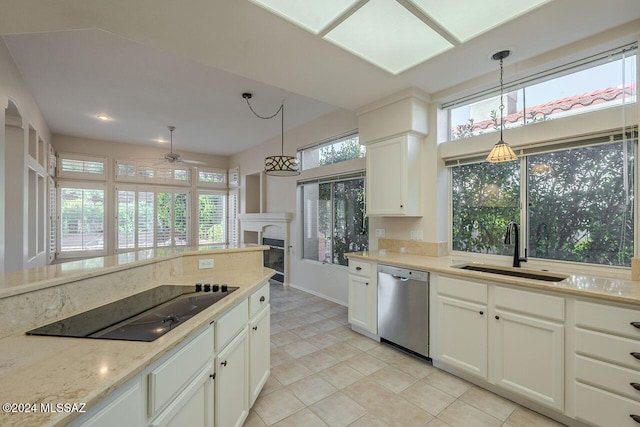 kitchen with dishwasher, a healthy amount of sunlight, black electric cooktop, and sink