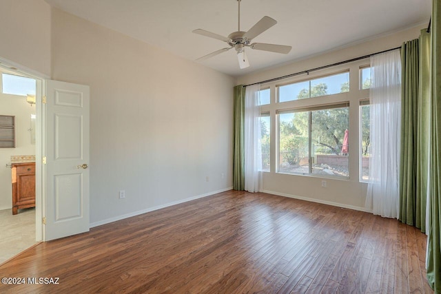 unfurnished room featuring ceiling fan and hardwood / wood-style floors