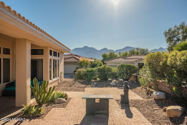 view of yard featuring a mountain view and a patio