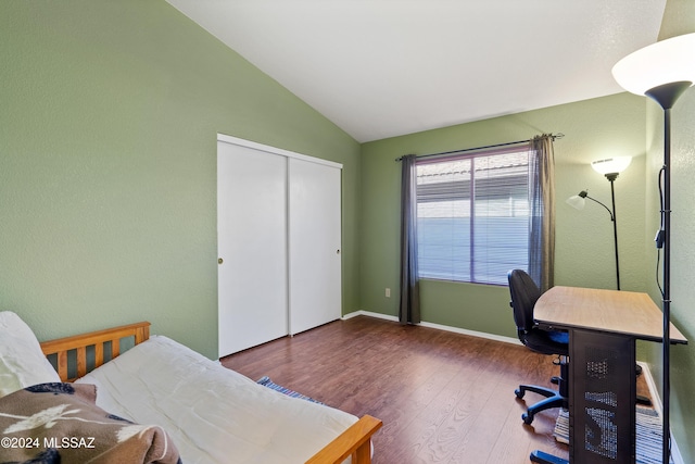 office space featuring hardwood / wood-style flooring and vaulted ceiling