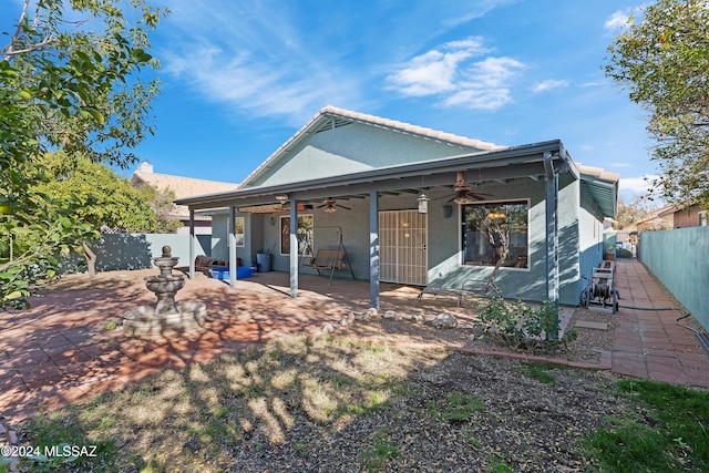 view of front of property with a patio area and ceiling fan