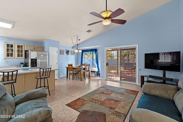 living room with ceiling fan, light tile patterned floors, and high vaulted ceiling