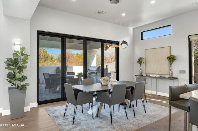 dining area featuring hardwood / wood-style floors