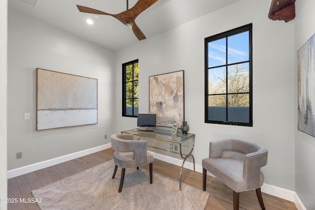 office space with ceiling fan and hardwood / wood-style floors