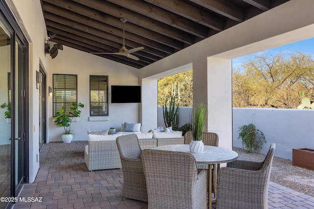 view of patio with ceiling fan and an outdoor living space