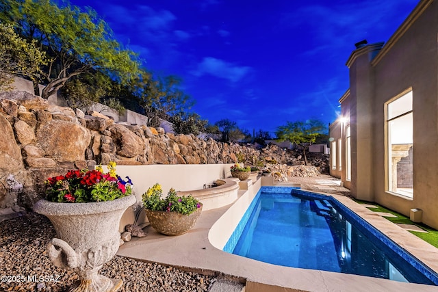 view of swimming pool featuring a patio area and a fenced in pool