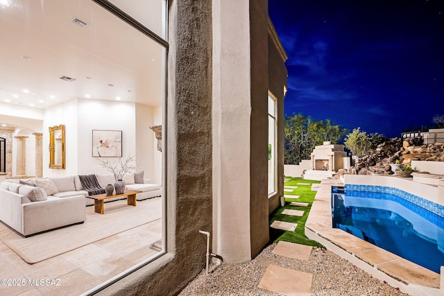 view of pool with a hot tub