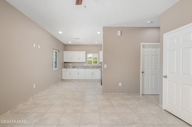 kitchen with recessed lighting, white cabinets, ceiling fan, and light tile patterned flooring