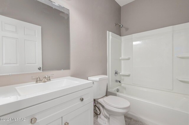 tiled spare room with ceiling fan