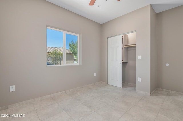 unfurnished bedroom featuring a closet and a ceiling fan