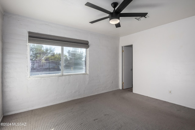 spare room with ceiling fan and carpet floors