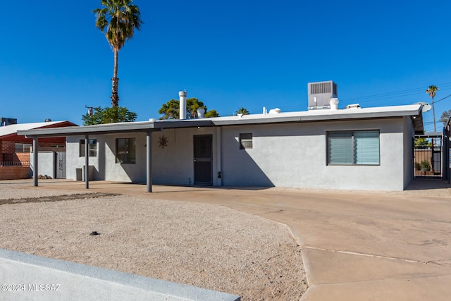 ranch-style home featuring central air condition unit