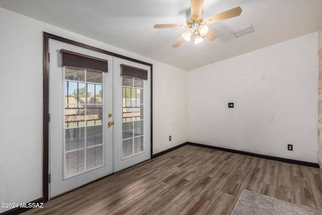 unfurnished room featuring ceiling fan, french doors, and hardwood / wood-style floors