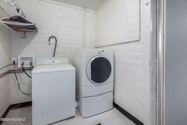 washroom with independent washer and dryer