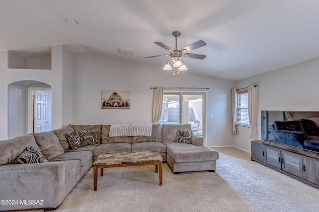 carpeted living room with vaulted ceiling and ceiling fan