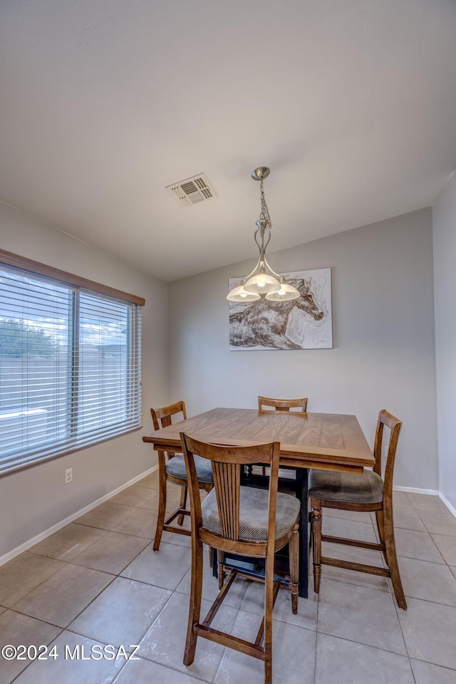 dining room featuring light tile patterned flooring