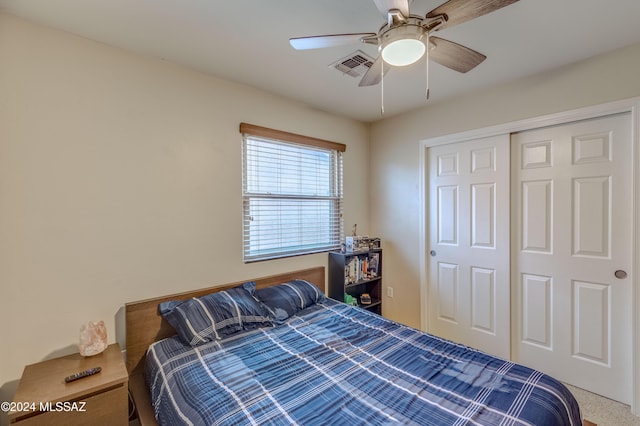 bedroom with ceiling fan, a closet, and carpet floors