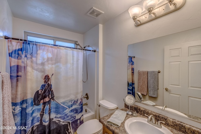 full bathroom featuring shower / tub combo with curtain, vanity, and toilet