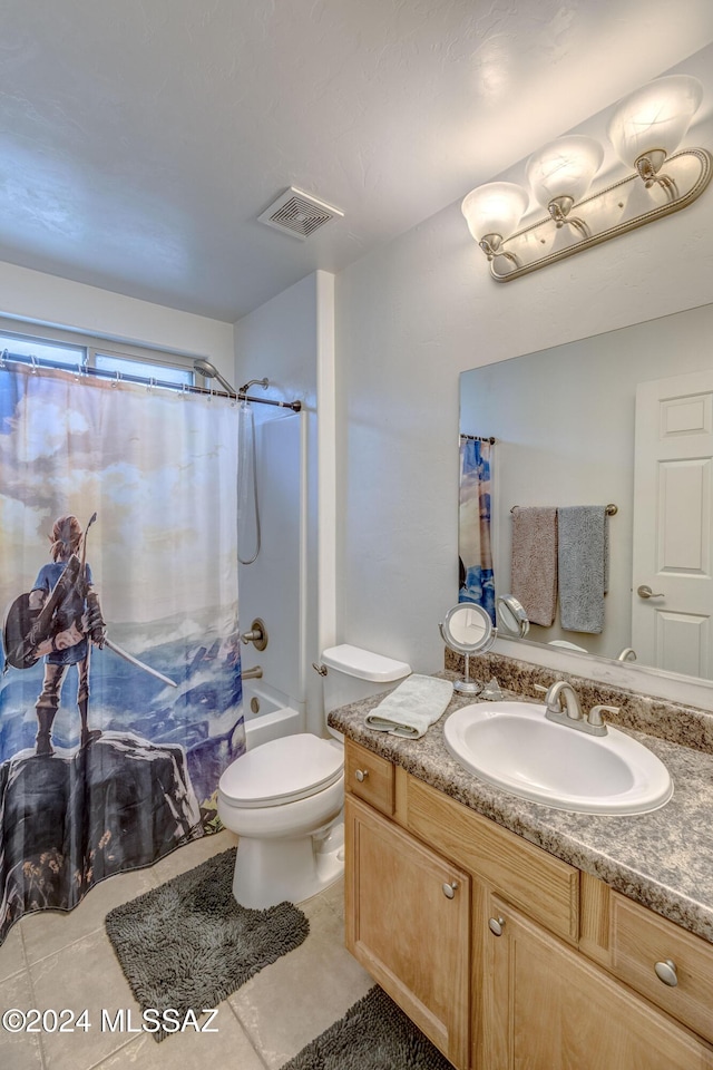 full bathroom featuring tile patterned flooring, shower / bath combination with curtain, vanity, and toilet