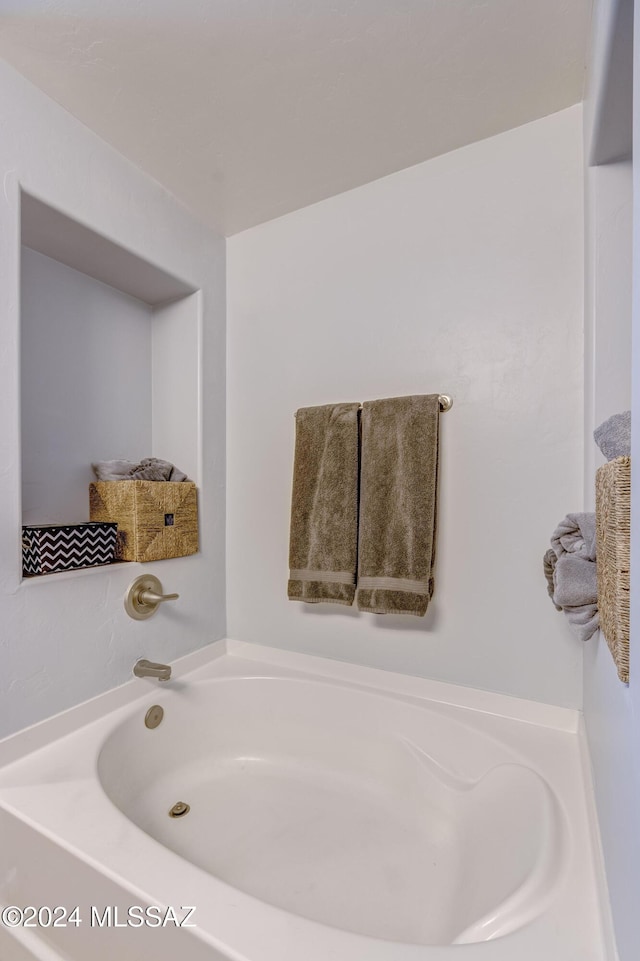 bathroom featuring a washtub