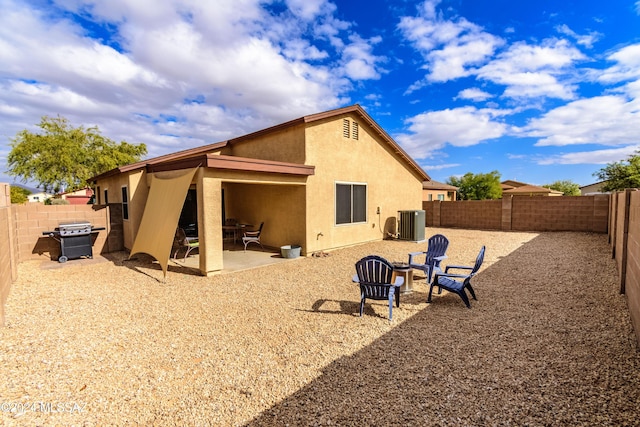 back of house featuring cooling unit and a patio area