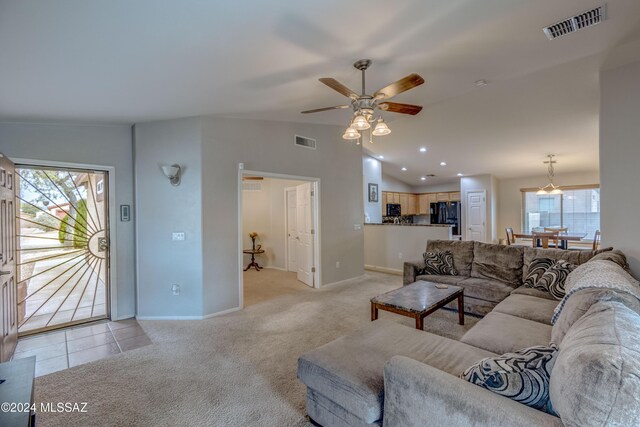 living room with light carpet and ceiling fan