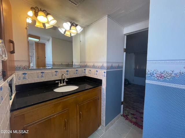 bathroom with tile patterned floors and vanity