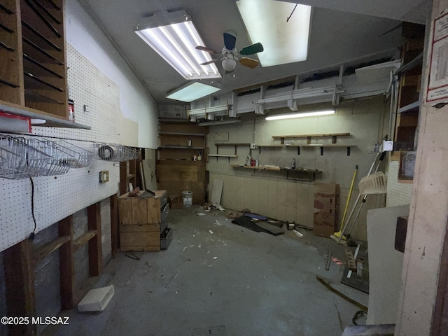 interior space featuring concrete flooring and ceiling fan