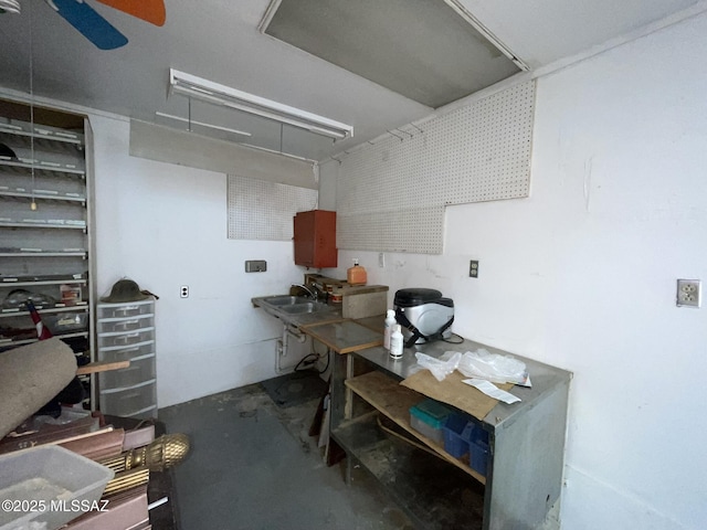 basement featuring sink and a workshop area