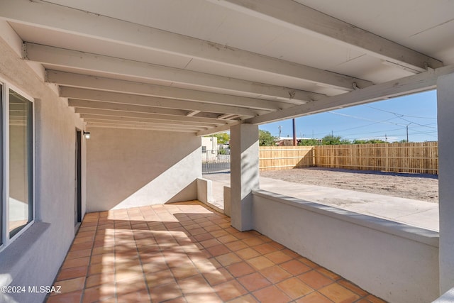 view of patio featuring fence