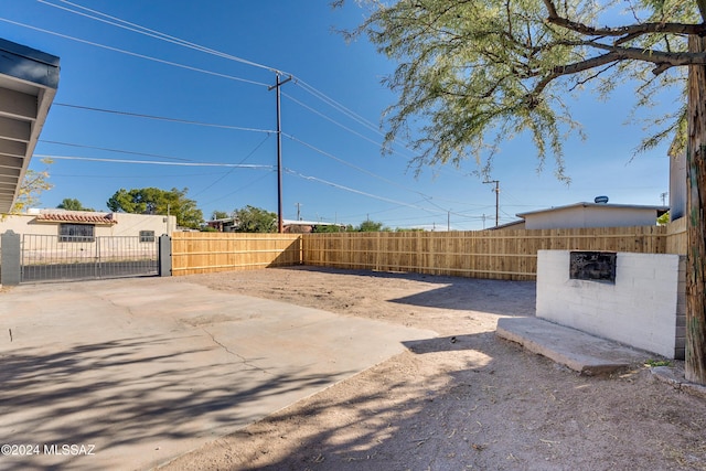 view of yard featuring a fenced front yard and a gate