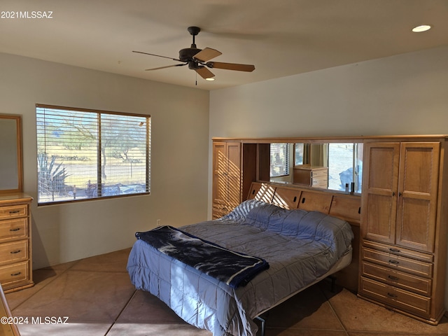 bedroom featuring ceiling fan and light tile patterned flooring