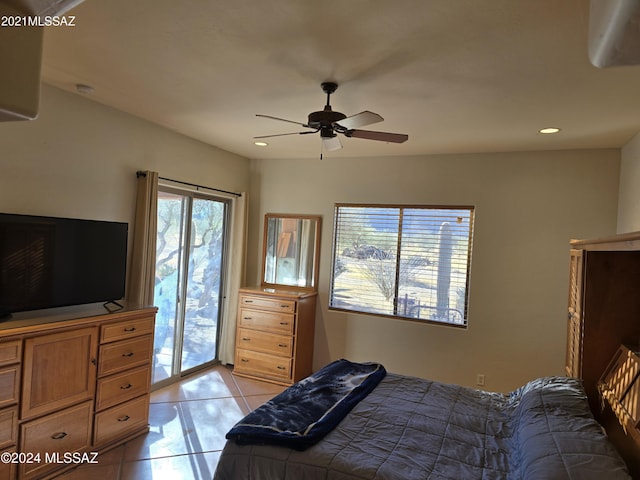 bedroom with ceiling fan, access to exterior, multiple windows, and light tile patterned flooring