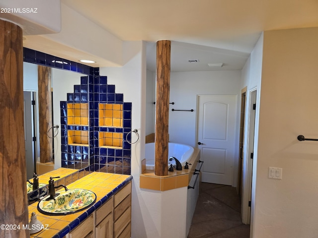 bathroom featuring vanity and a bathing tub