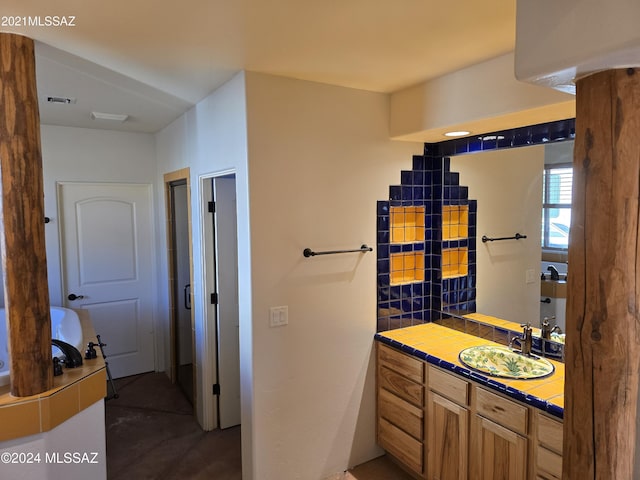 bathroom featuring backsplash and vanity