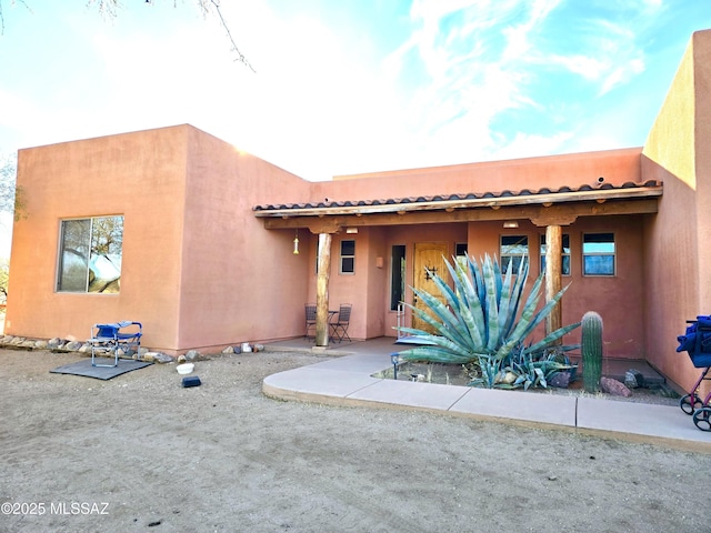 southwest-style home featuring a patio