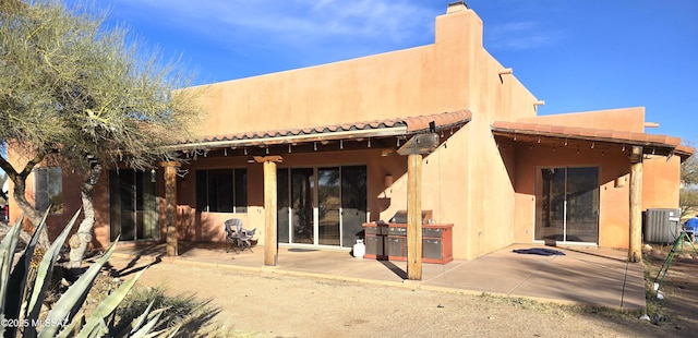rear view of house with a patio area