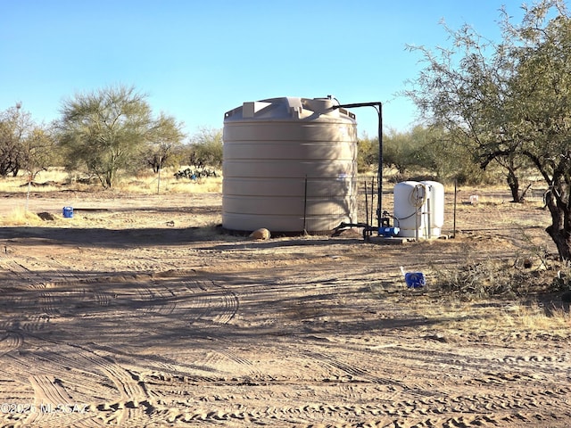 view of outdoor structure with a rural view