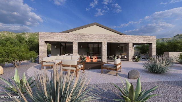 rear view of property featuring an outdoor living space with a fireplace and a patio area